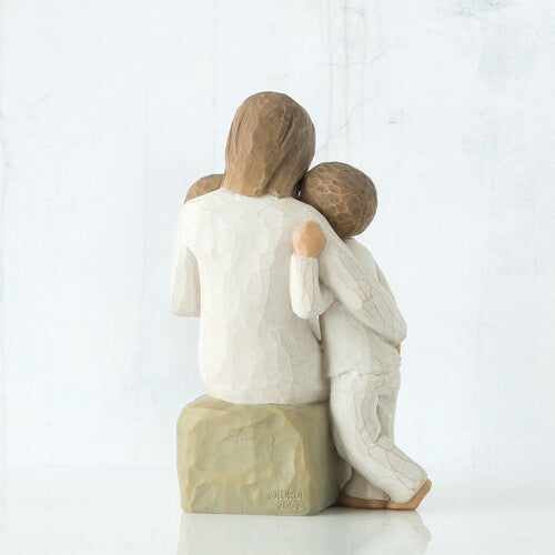Willow Tree 'Quietly' Figurine. A seated mother holding one young child with another child standing beside her.