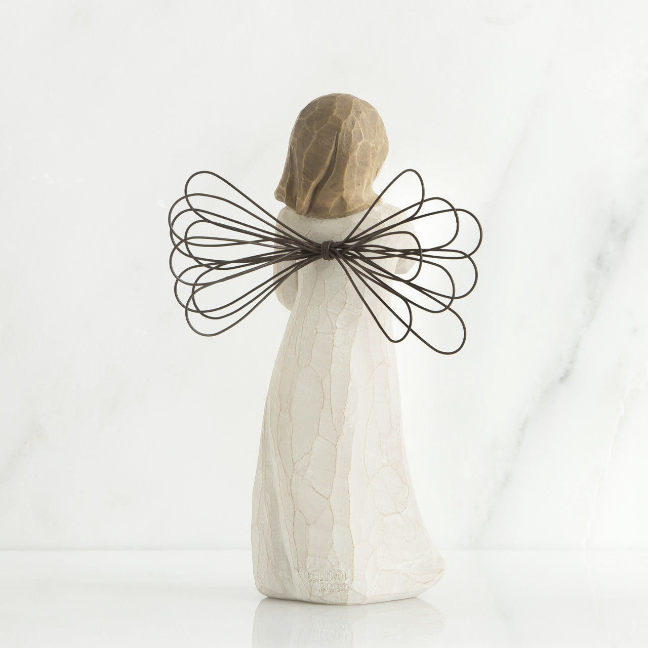Willow Tree 'Angel of the Garden' Figurine depicts an angel figure holding a shovel as if leaving on it. Figurine Height Approx: 13cm.
