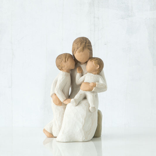 Willow Tree 'Quietly' Figurine. A seated mother holding one young child with another child standing beside her.
