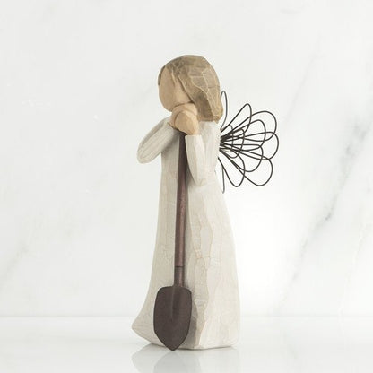 Willow Tree 'Angel of the Garden' Figurine depicts an angel figure holding a shovel as if leaving on it. Figurine Height Approx: 13cm.