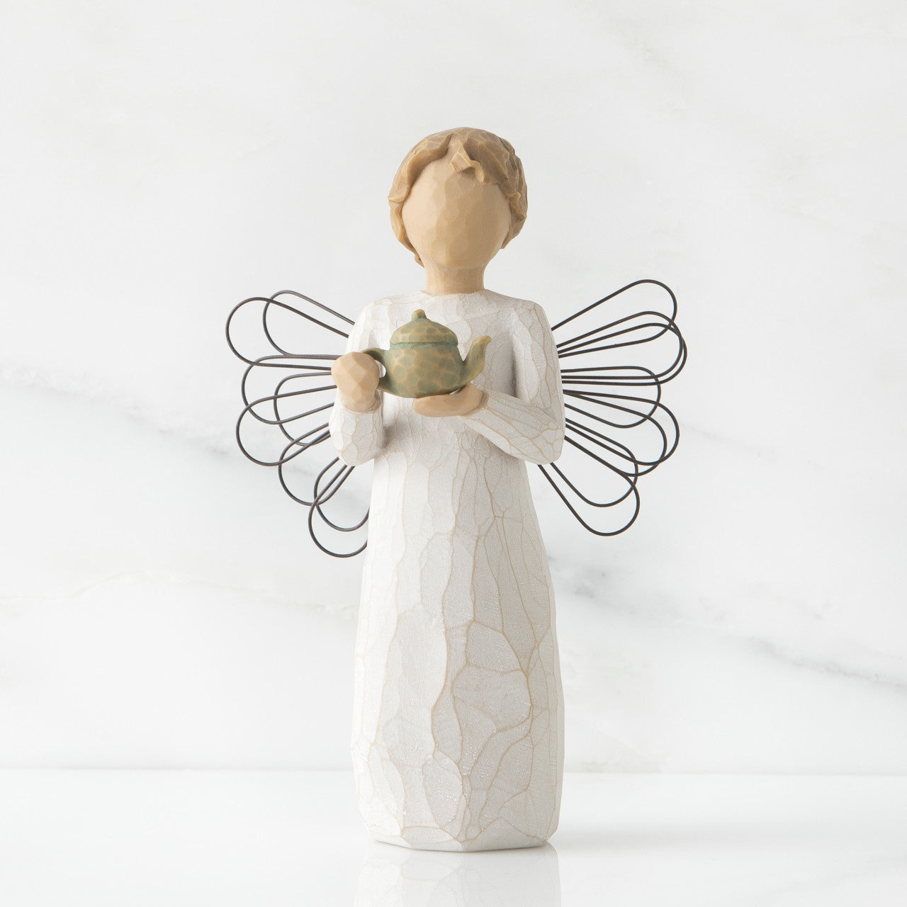 Willow Tree 'Angel Of The Kitchen' Figurine depicts an angel figure holding a teapot. Height: 14 cm.