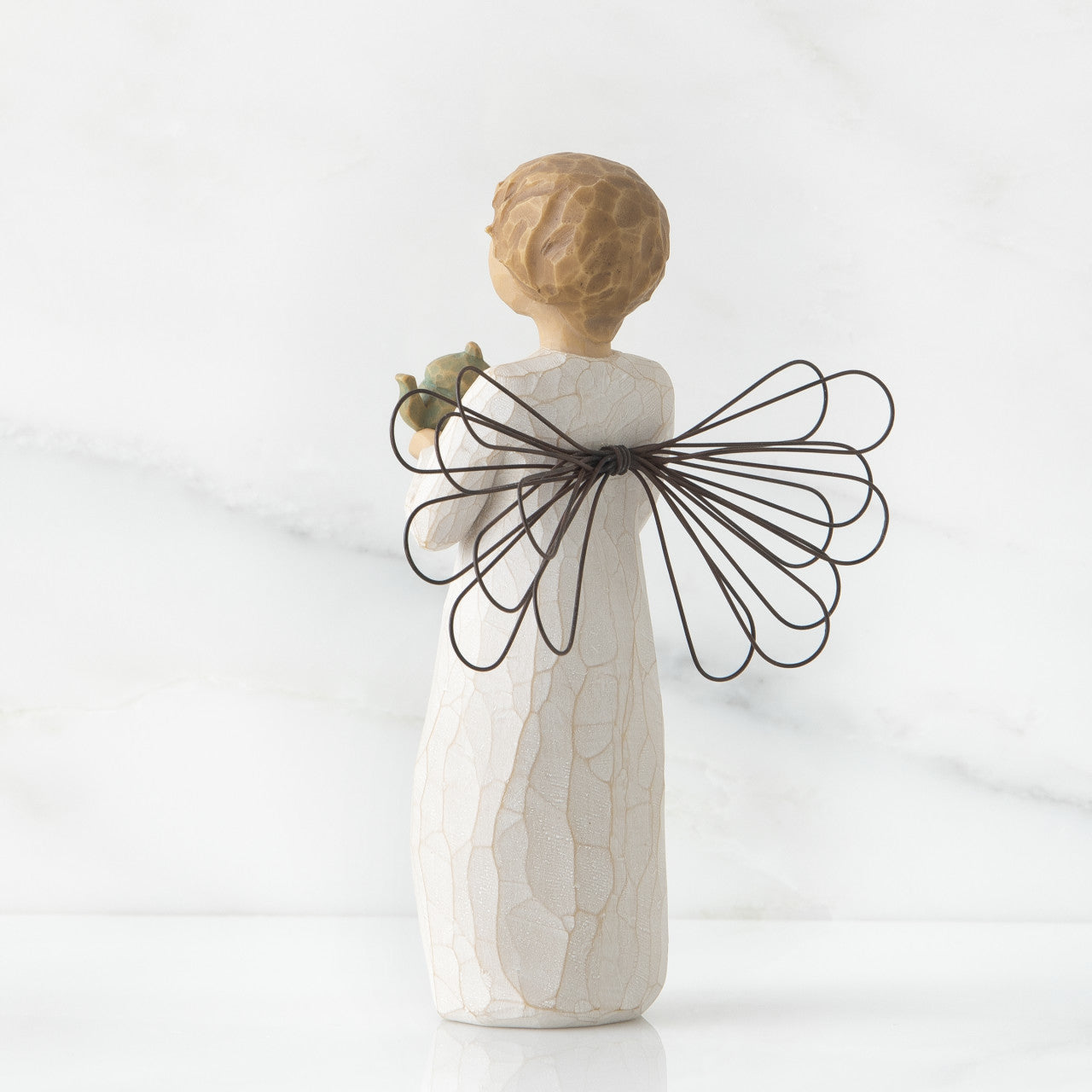 Willow Tree 'Angel Of The Kitchen' Figurine depicts an angel figure holding a teapot. Height: 14 cm.