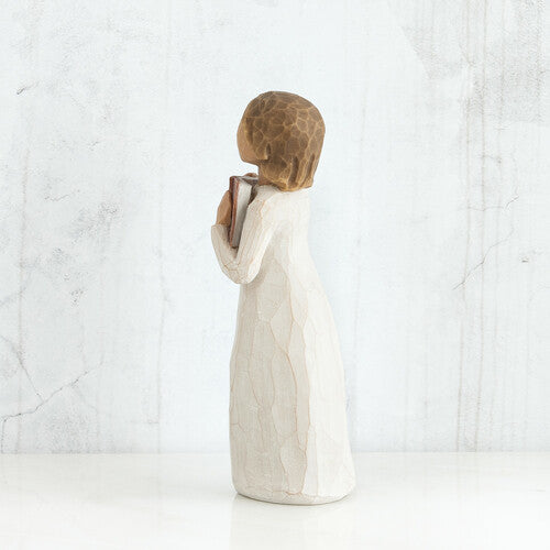 Willow Tree 'Love of Learning' Figurine. A young girl holding an open book close to her chest.