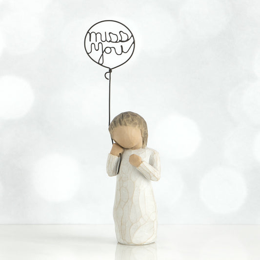 Willow Tree 'Miss You' Figurine. A figure holding a wire balloon with the words miss you within it.