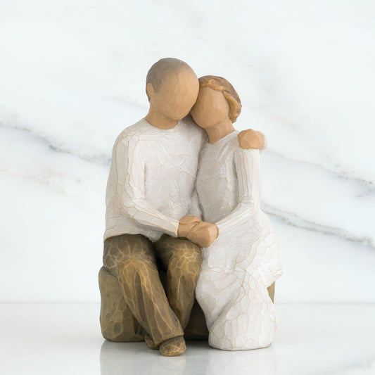 Willow Tree 'Anniversary' Figurine depicts a man and woman sitting beside each other in an embrace. Figurine Height Approx: 15cm x 9cm (width).