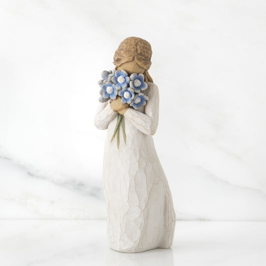 Willow Tree 'Forget-me-not' figurine. A girl holding a bouquet of blue flowers.
