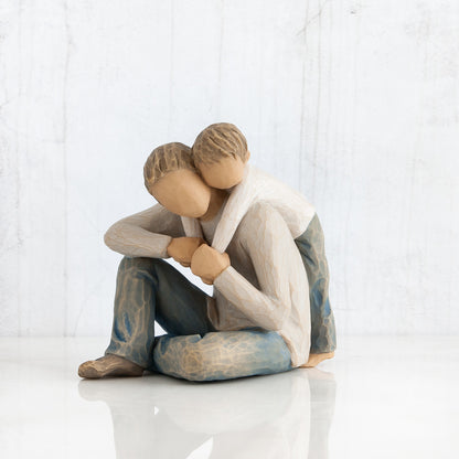 Willow Tree 'That's my Dad'. A Father seated with his young child behind him with arms wrapped around his neck.