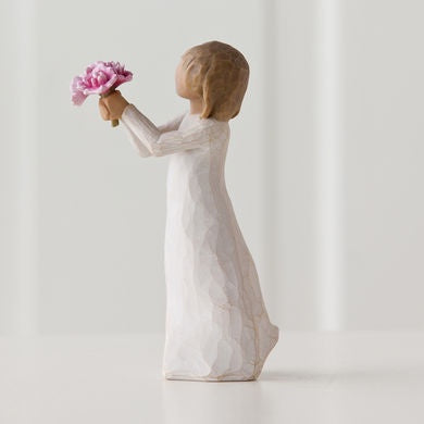 Willow Tree 'Thank You' Figurine. A young girl holding a bouquet of pink flowers in outstretched arms as if offering them to someone.