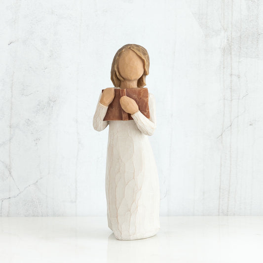 Willow Tree 'Love of Learning' Figurine. A young girl holding an open book close to her chest.