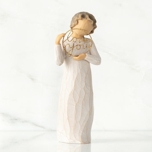 Willow Tree 'Love You' Figurine. A female figure holding a golden circle with love you written within.